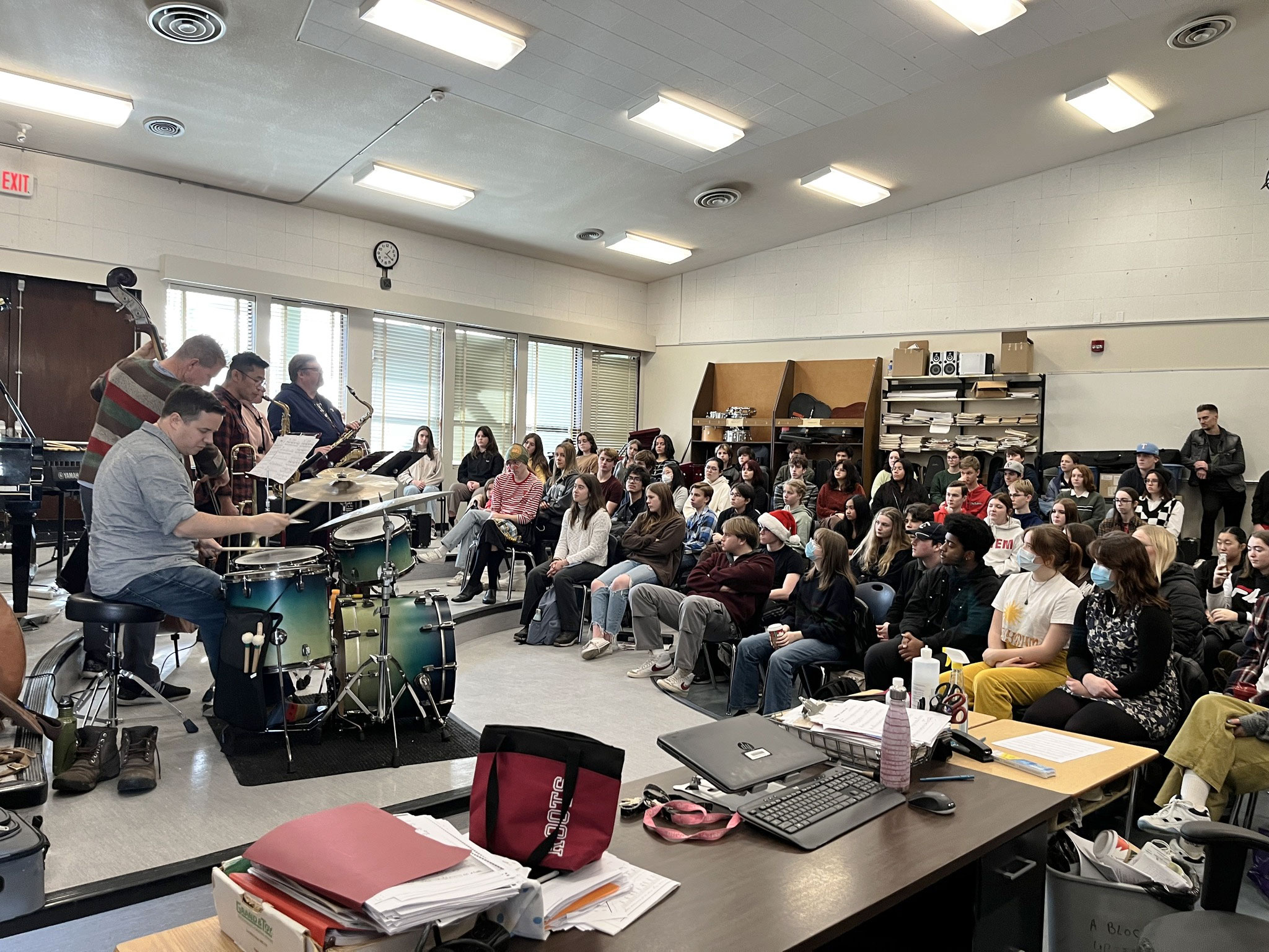 A working jazz ensemble demonstrates for students gathered in a Nanaimo music classroom