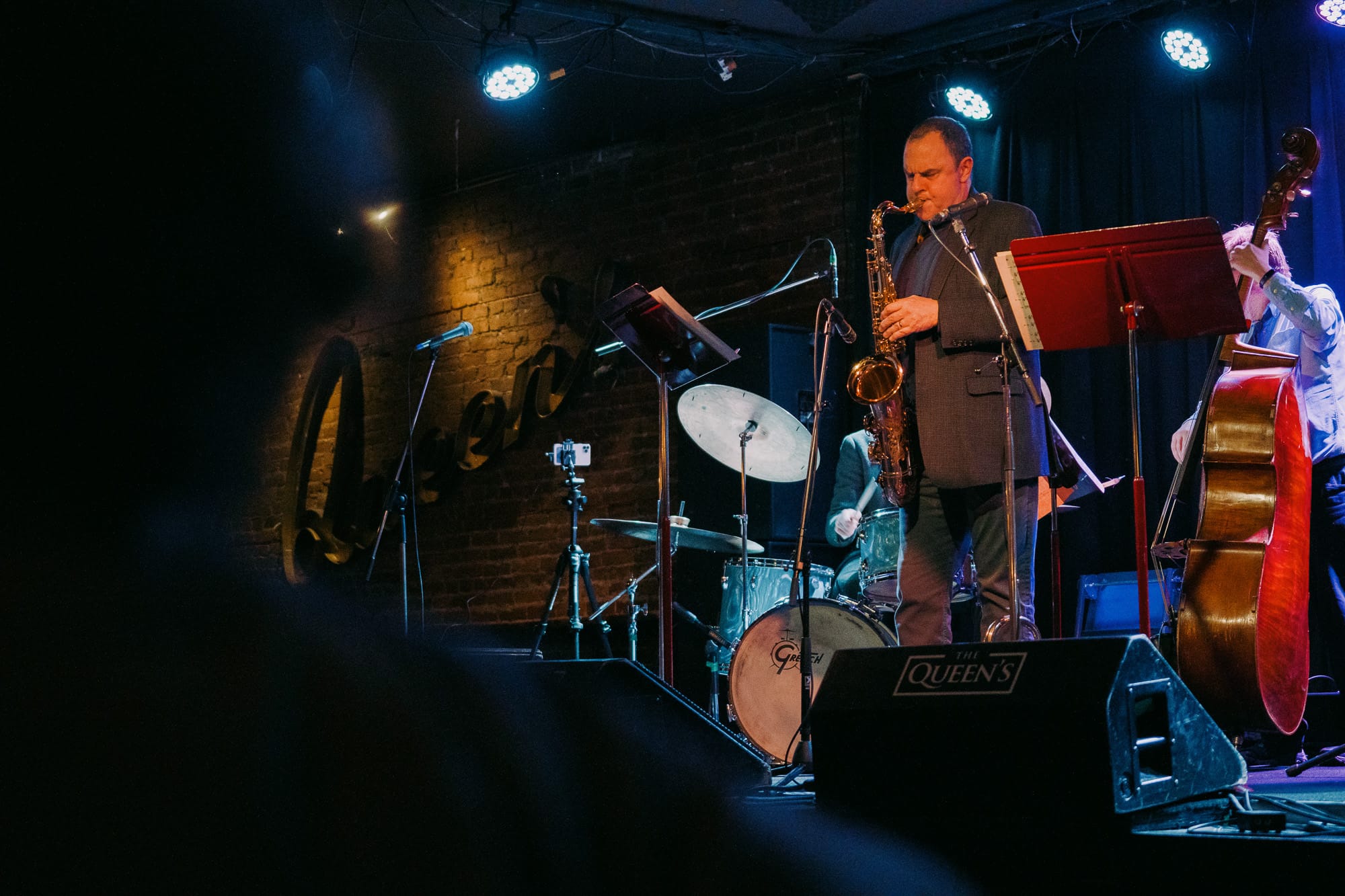 A saxophonist performs with a jazz group on stage at The Queen's in Nanaimo